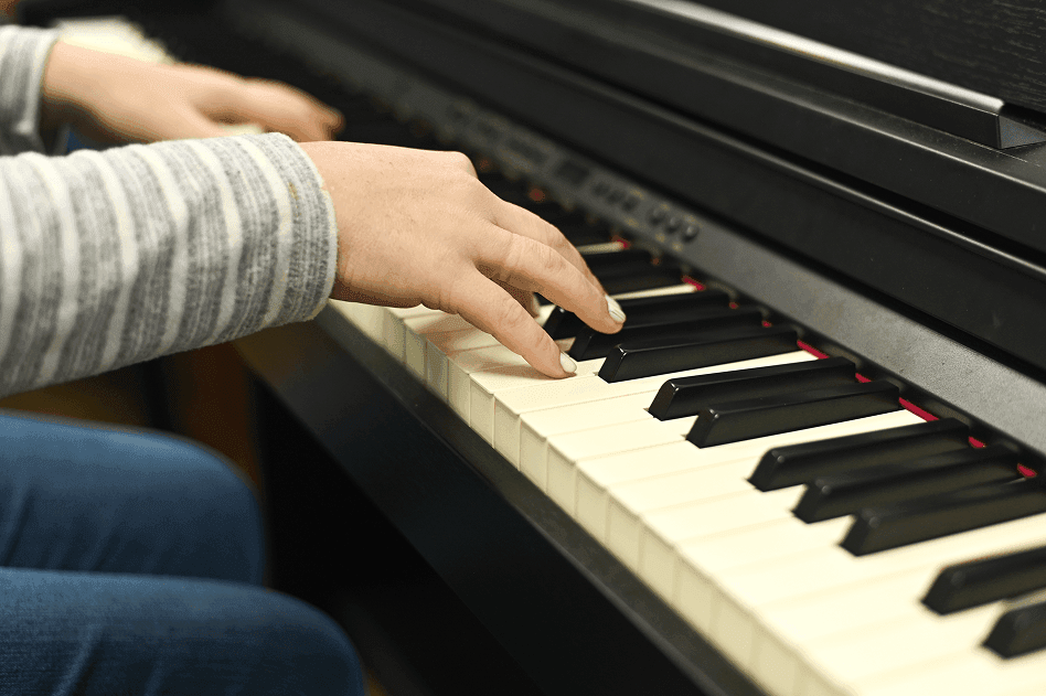 Piano detail — warm studio atmosphere